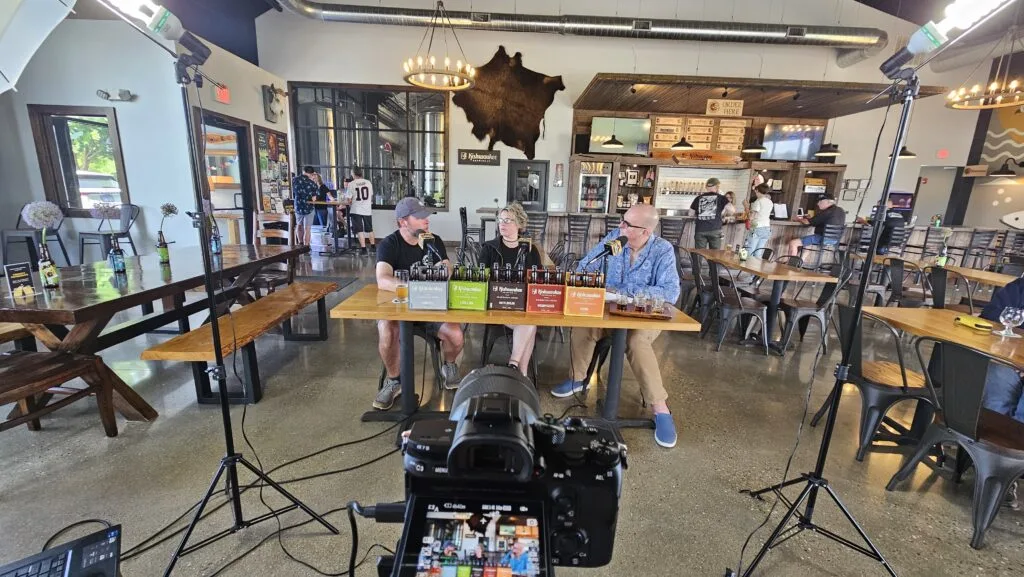 Kishwaukee Brewing Co's Dan Payson (left) and Cara Payson (center) talk to Crafty Brewers podcast host Brian Noonan (right)